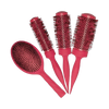 Set of red hairbrushes on a white background