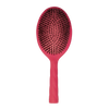Red hairbrush with black boar bristles on a white background