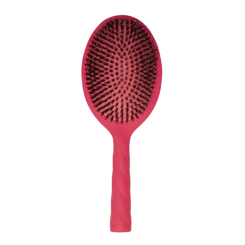 Red hairbrush with black boar bristles on a white background