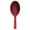 Red hairbrush with black bristles on a white background