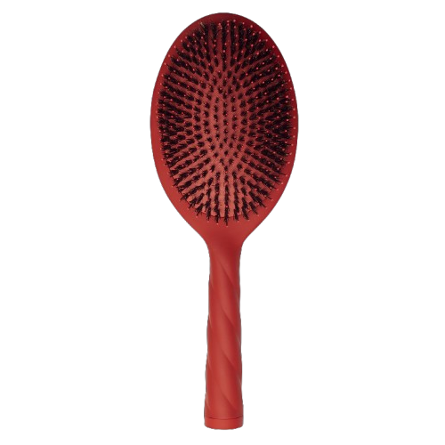 Red hairbrush with black bristles on a white background