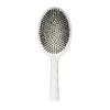 White paddle hair brush with black bristles on a white background
