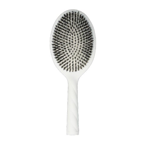 White paddle hair brush with black bristles on a white background