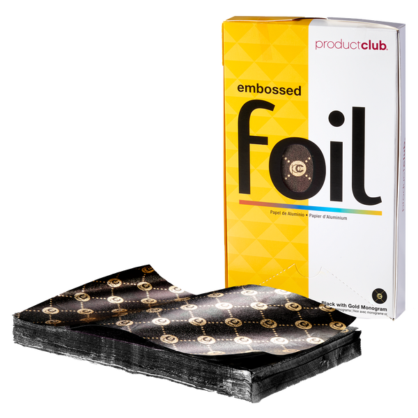 A pack of embossed black foil sheets with gold monogram patterns, shown in front of their yellow and white Product Club retail box.