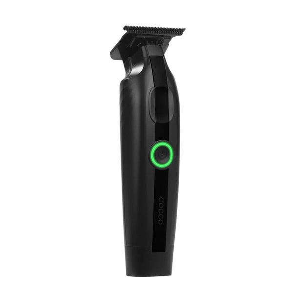 A black cordless hair trimmer with a green illuminated power button, shown against a plain white background.
