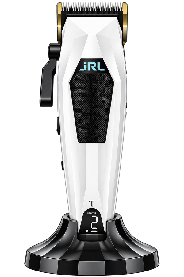 A JRL cordless electric hair clipper with a white and black body, gold-colored metal clipper head, and a black charging base, shown on a solid white background.