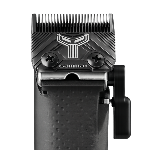 A close-up studio shot of a black cordless hair clipper head showing the blade assembly, textured handle grip, and side release lever against a solid white background.