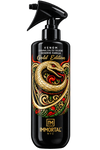 Immortal Venom Gold Edition perfume spray bottle. The black trigger spray bottle features a detailed graphic of a gold snake coiled around red roses with green leaves, and gold and red text on the label.