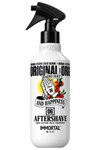 A white spray bottle of Immortal 'Original & Original' Aftershave with a black trigger sprayer and a colorful graphic of praying hands with roses and a sunburst.
