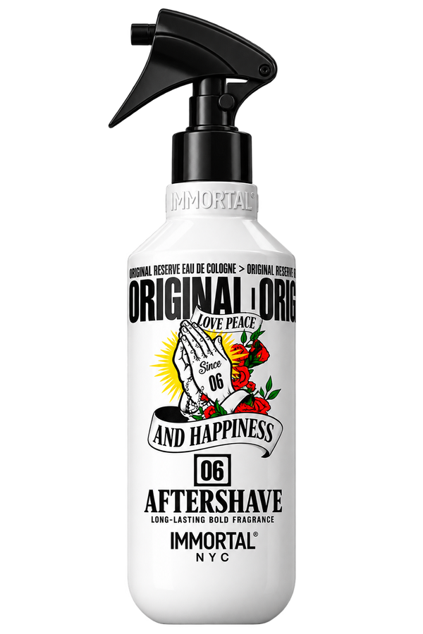 A white spray bottle of Immortal 'Original & Original' Aftershave with a black trigger sprayer and a colorful graphic of praying hands with roses and a sunburst.