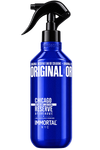 A cobalt blue spray bottle of Immortal Chicago Family Edition Reserve Aftershave with a black trigger sprayer, isolated on a white background.