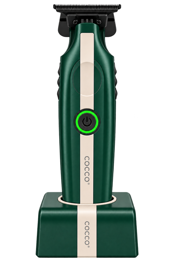 A Cocco electric trimmer in dark green and cream, standing upright on its matching charging dock against a solid white background.