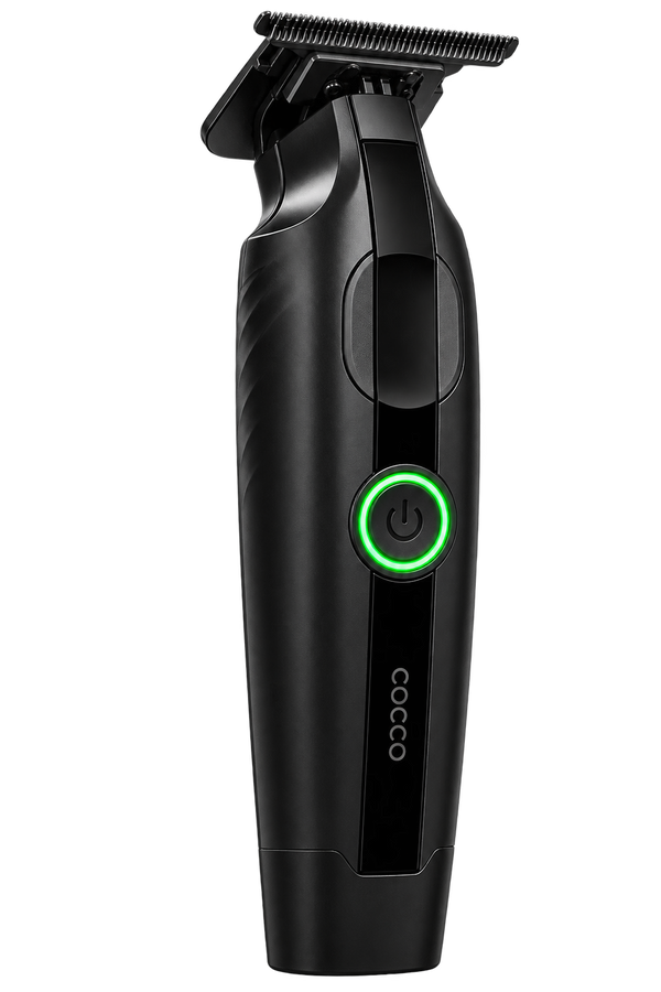 A black cordless hair trimmer with a green illuminated power button, shown on a solid white background. The brand name 'COCO' is printed vertically near the bottom.