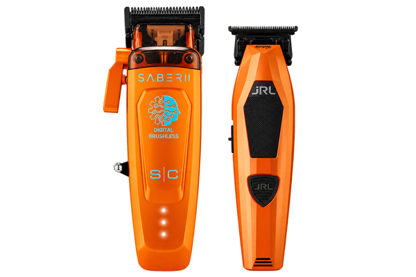 Two orange cordless hair clippers shown side by side on a plain white background. The left clipper is labeled SABER II and features a blue circular graphic with the words 'DIGITAL BRIGHTNESS'; the right clipper is labeled JRL.
