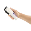 Hand holding a white grooming clipper with visible brand name on a white background