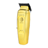 Gold hair clipper with 'Saber II' branding on a white background