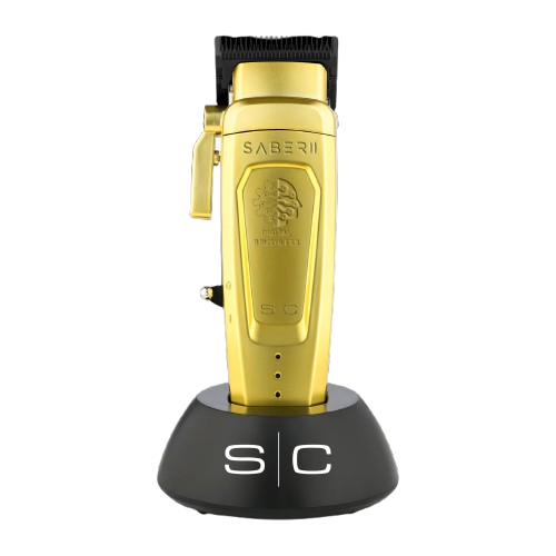 Gold hair clipper with black accents on a white background