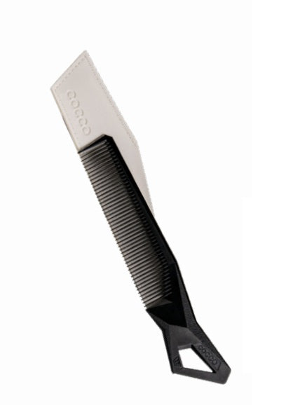 Black comb with a blade on a white background