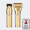 Two gold electric shavers on a white background with a warning label.