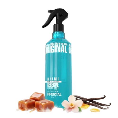 Immortal NYC Blue afterhsave spray bottle with vanilla beans, flowers, and caramels on a white background