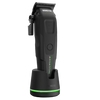 Black grooming clipper with green accents on a white background