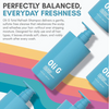 Oli G Total Refresh Shampoo bottle with product description on a colorful background