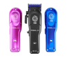 Three hair clippers in purple, black, and blue on a white background